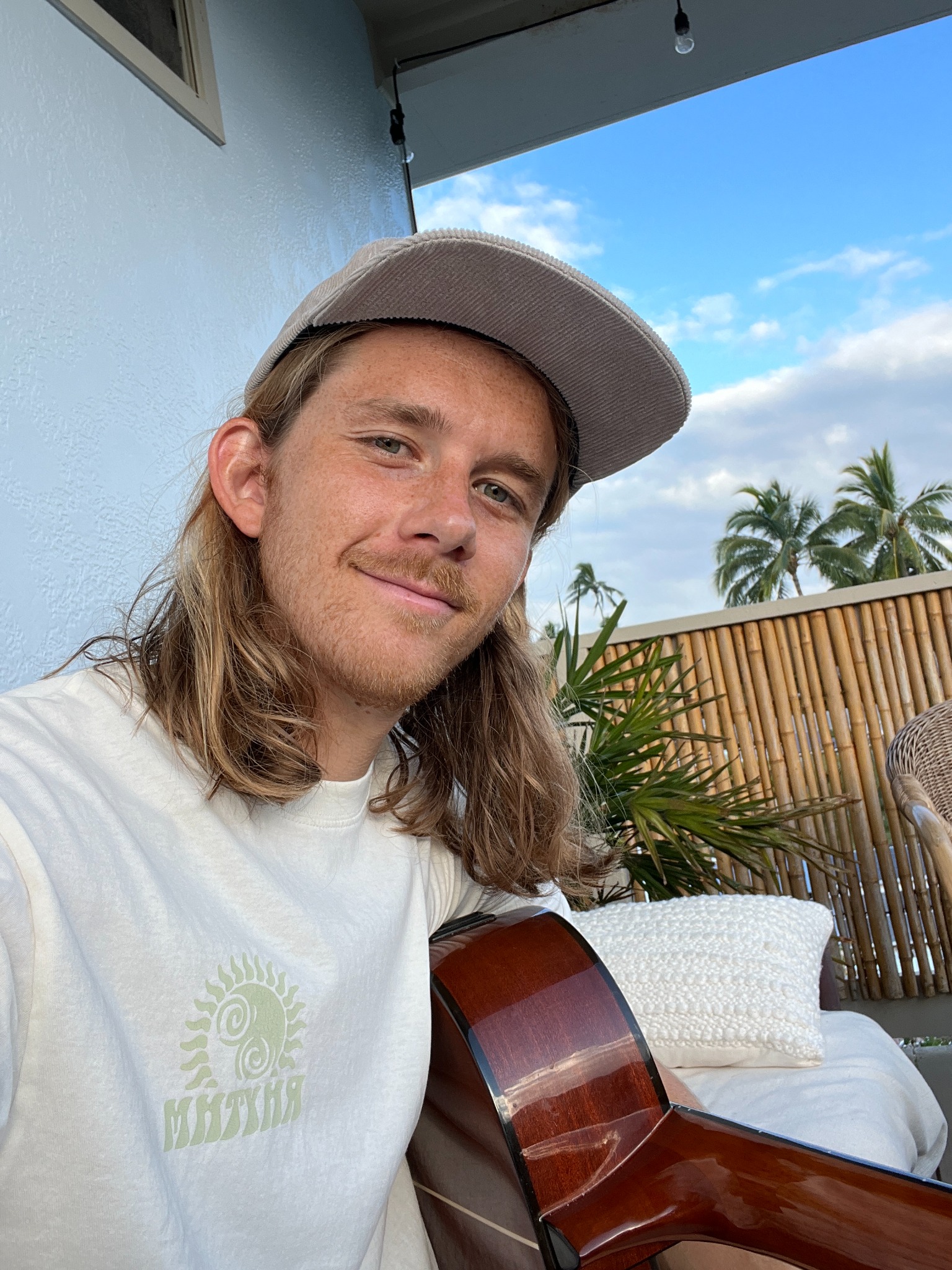 Ocean-level photograph with a surfer beyond the water
